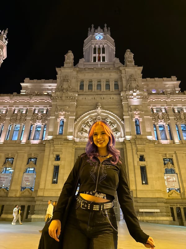 Nighttime architectural tour through illuminated historic Madrid buildings captured