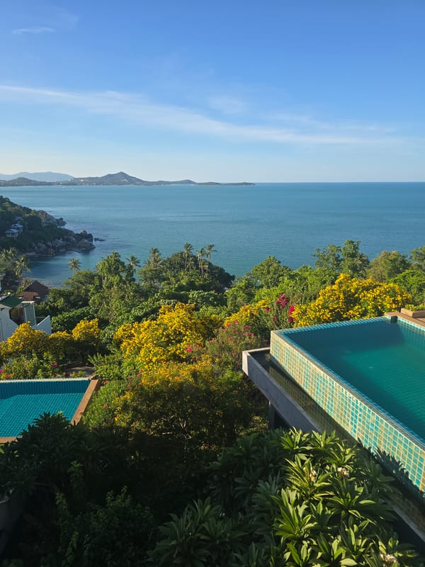 Tropical hillside resort views mixed with busy street-level scooter traffic