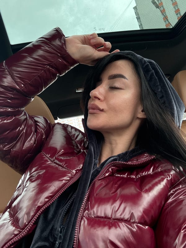 Woman rests in car in Krasnoyarsk