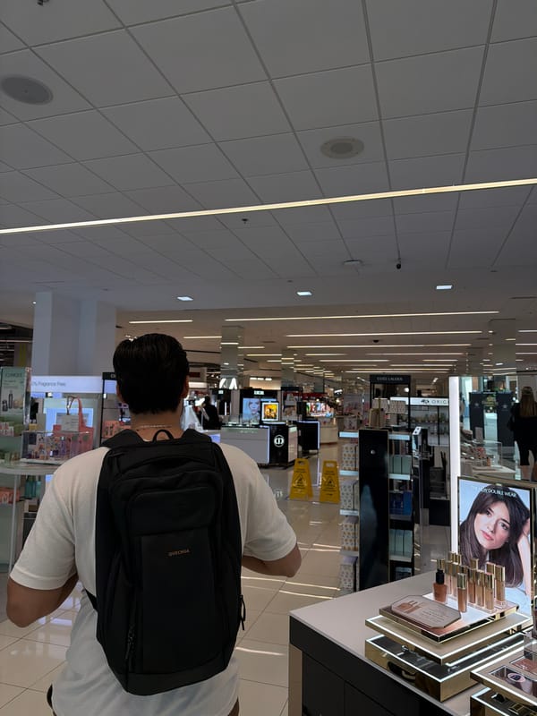 Man with backpack shops in Atlanta department store
