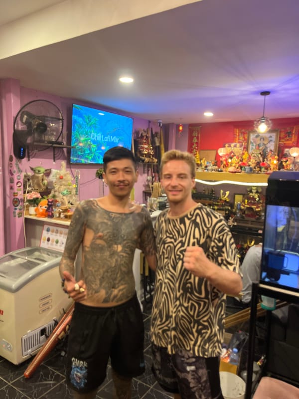 Inside a Phuket space mixing samurai displays, shrines, and koi