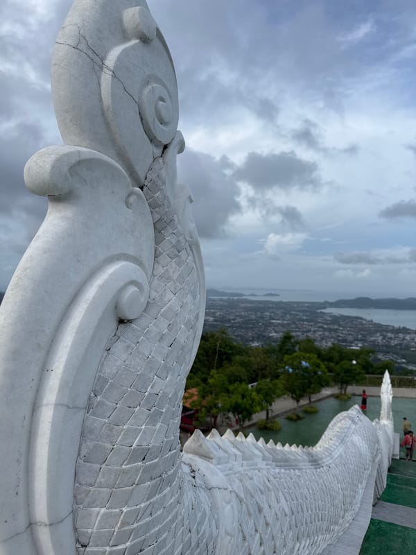 Cracked white serpent sculpture observed in Chalong, Thailand