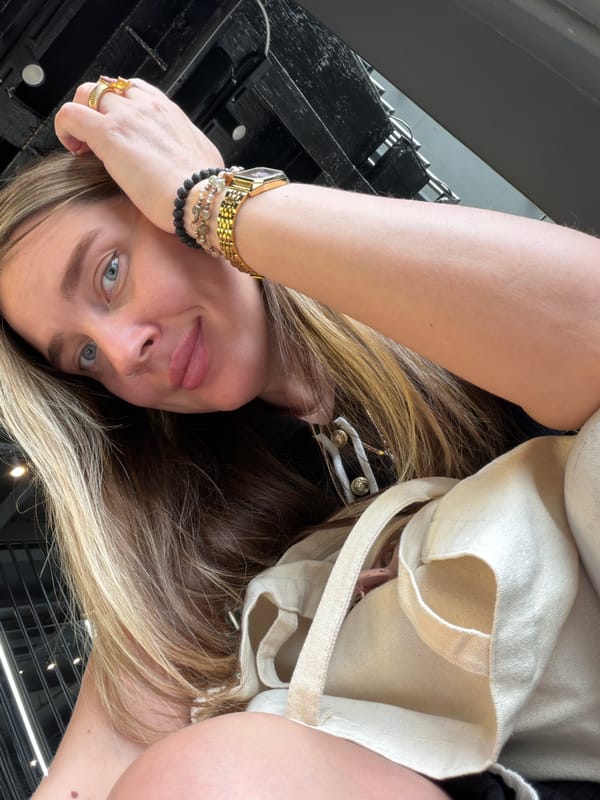 Woman takes tilted selfie in Moscow wearing gold jewelry