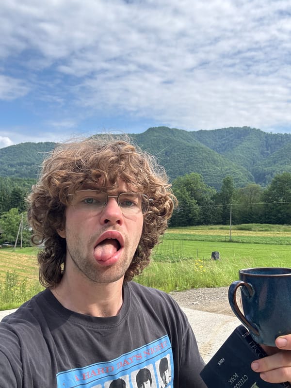 Outdoor selfie series: Beatles tee, black dog, blue mug