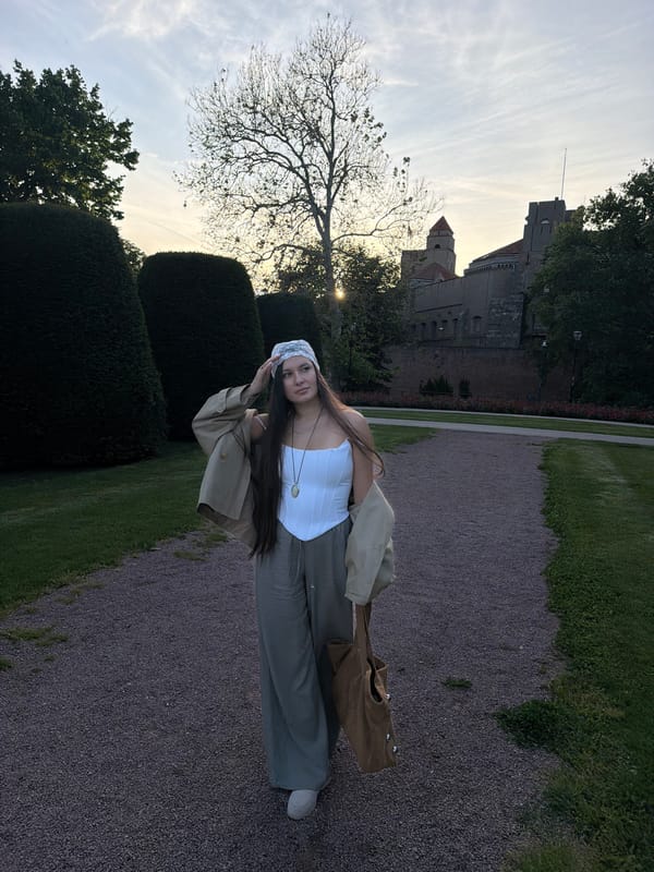 Woman in period-style outfit photographed around Belgrade parks, buildings
