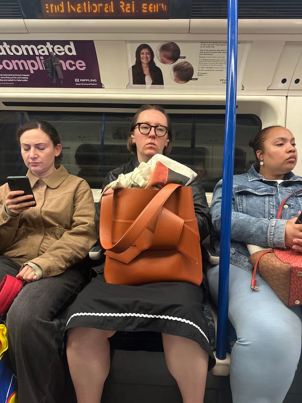 Three Women Photographed on London Underground Train Carriage
