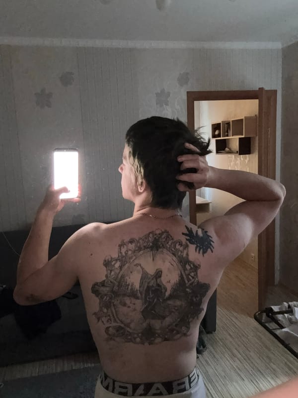 Tattooed leg, fake lavender, phone — casual home shoot in Minsk