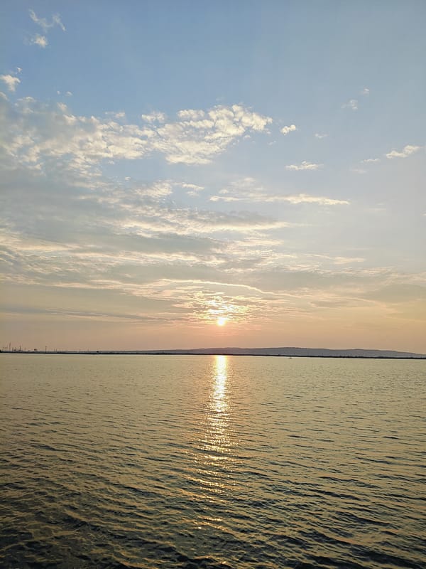Golden sunset over calm Russian waterway, Chaikovsky