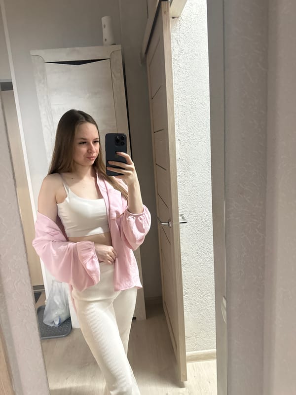 Woman takes multiple mirror selfies indoors during 44-minute session
