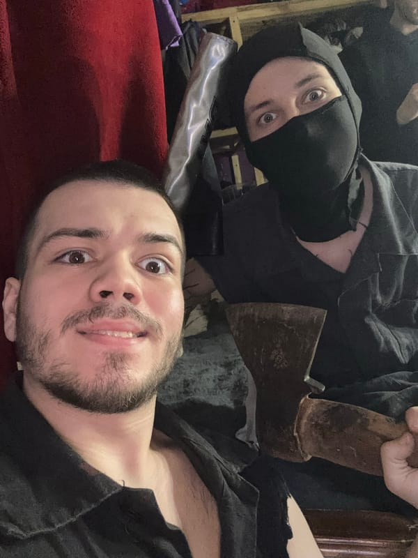 Masked figure photographed in dimly lit interior in Saratov