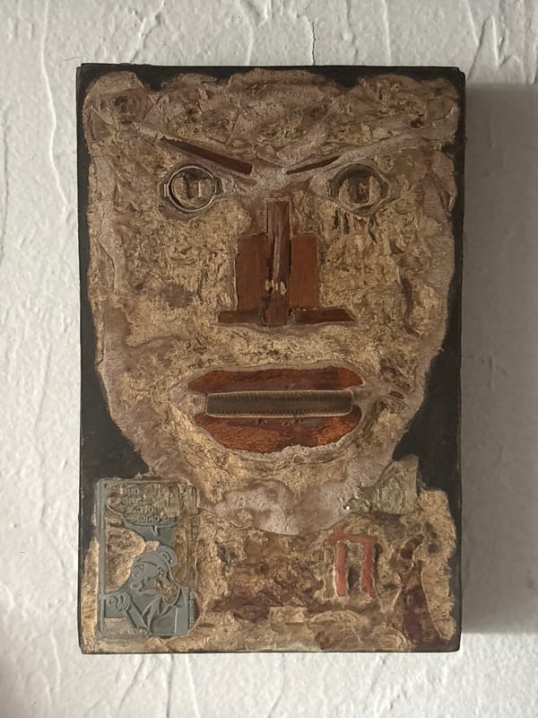 Mixed-media artwork observed on textured wall in Mexico City