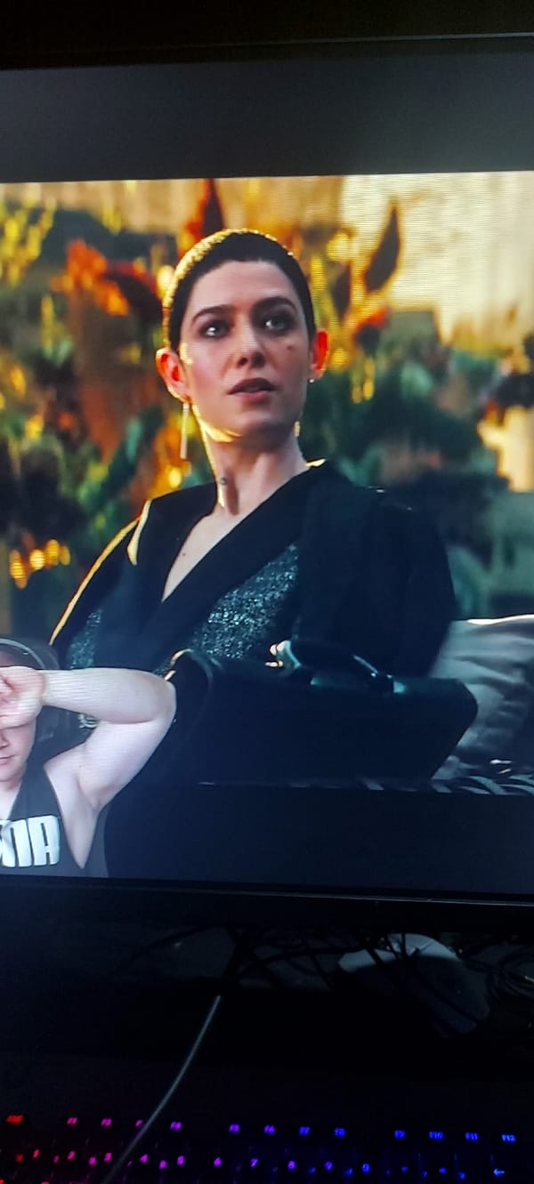 Monitor display and beverage observed in Tashkent workspace