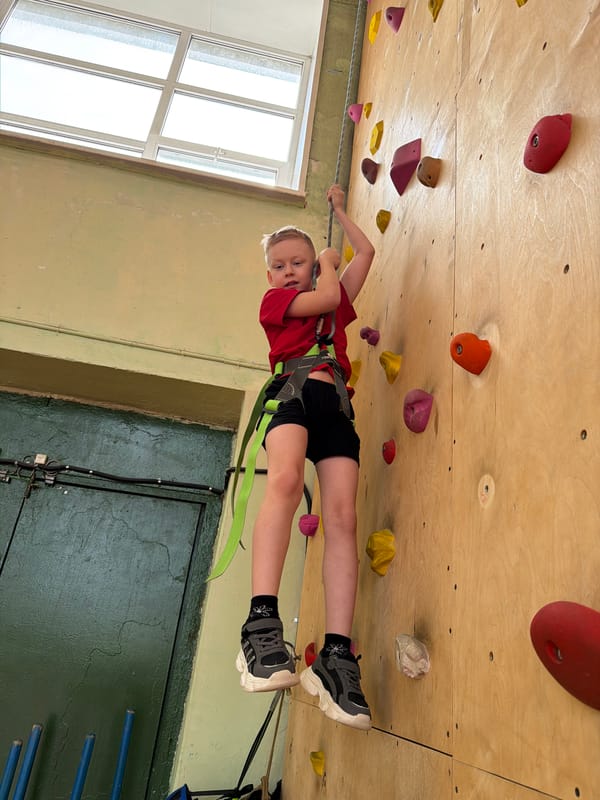 Children practice indoor rock climbing in Izhevsk facility