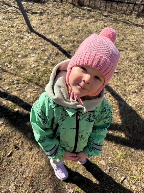 Mother and child enjoy outdoor time near Russian village