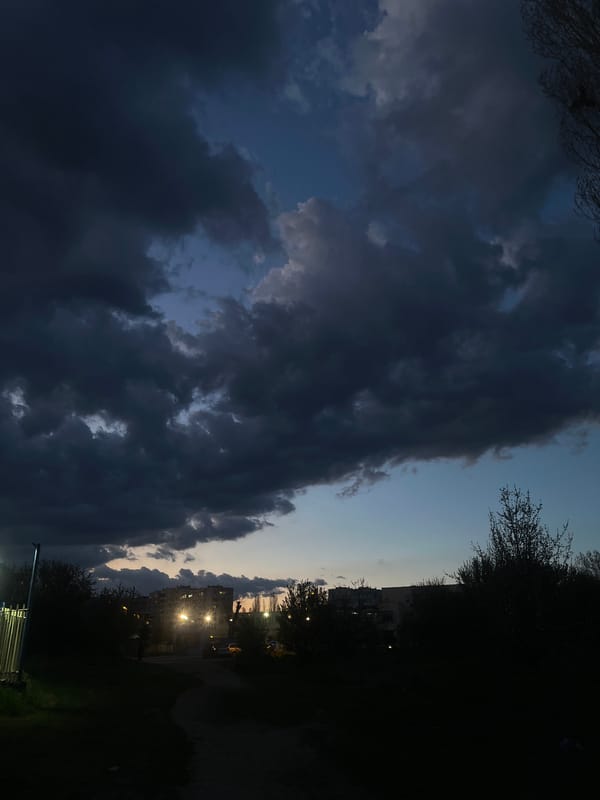 Evening tram operates under storm clouds in Sofia