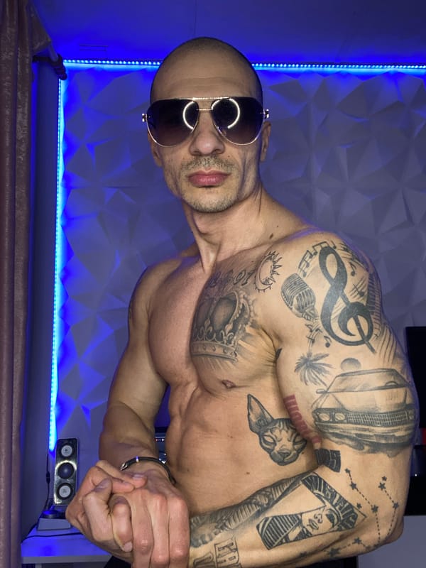 Tattooed man conducts indoor photo session in Bulgaria