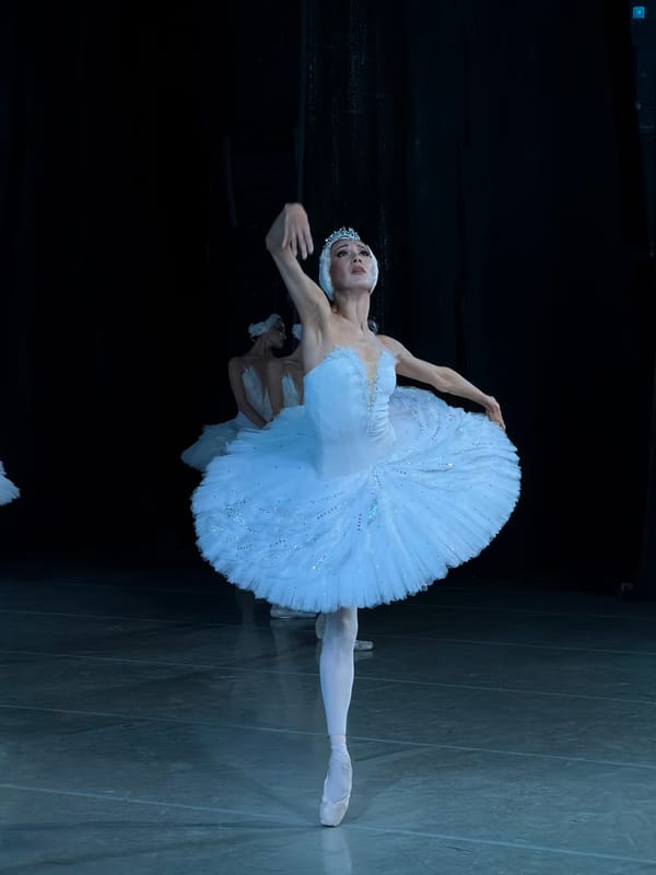 Swan Lake-style ballet performance on a dramatic dark stage in Ufa