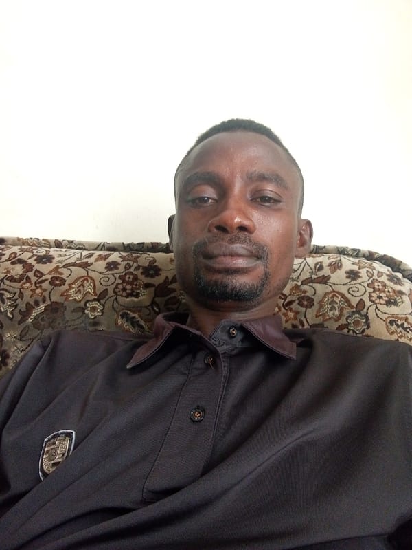 Two people observed resting in indoor lounge area