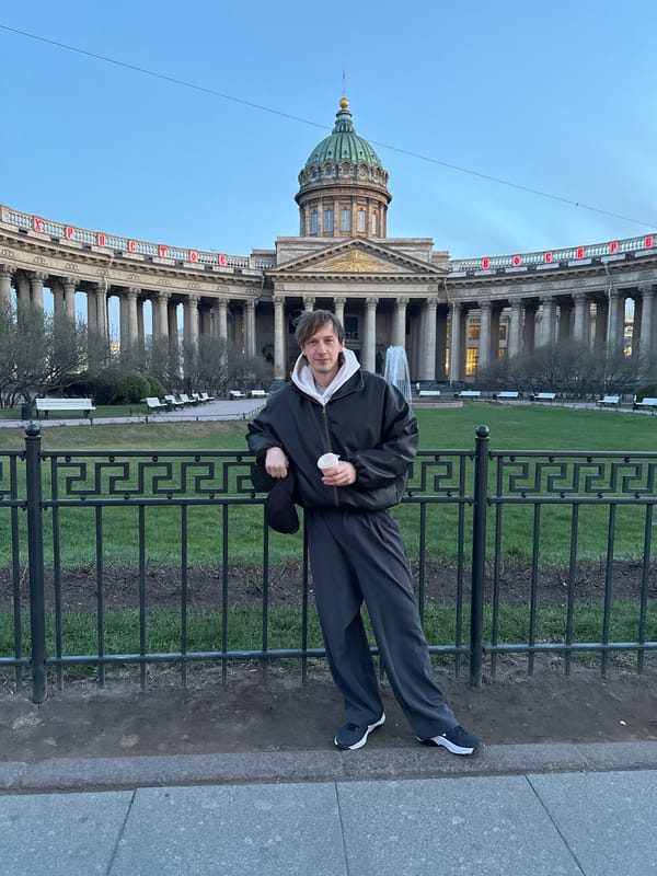 Person rests on fence, floral car spotted in Saint Petersburg