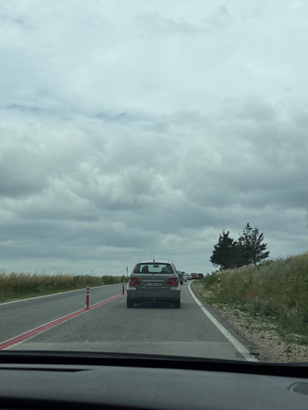 Vehicle travels cone-lined road in Pleven, Bulgaria