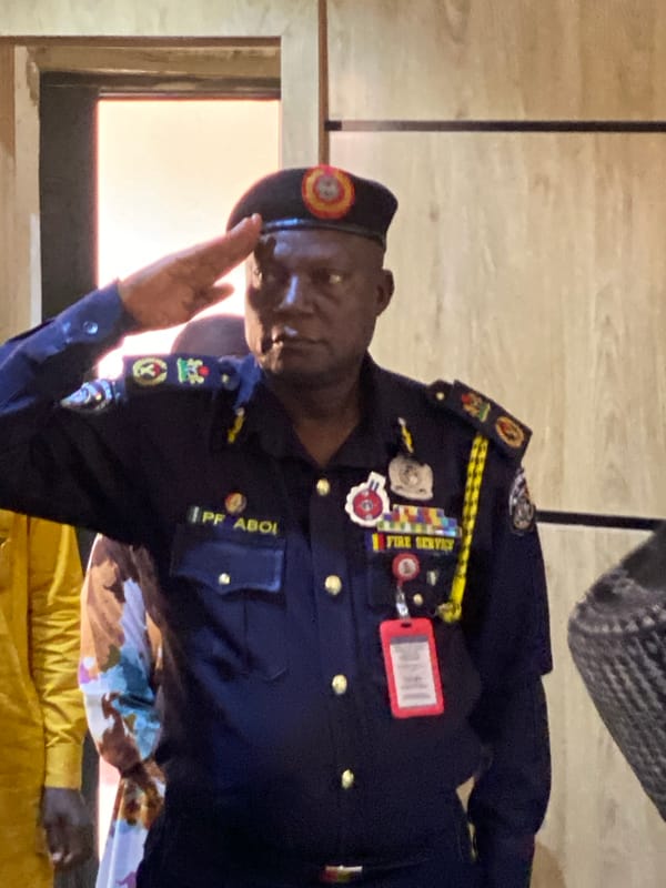 Official gathering with fire service personnel documented in Shaba