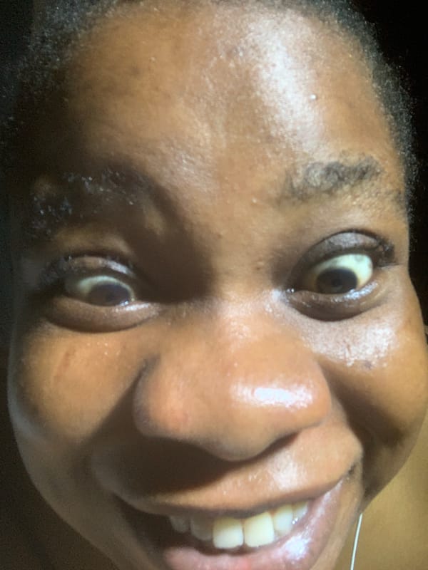 Woman photographed smiling in close-up shots during evening hours