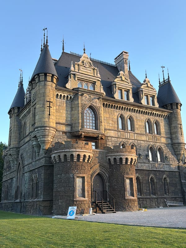 Tourist documents Garibaldi Castle grounds during golden hour visit