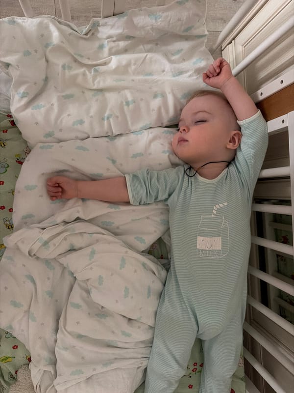 Baby sleeps peacefully in decorated crib in Votkinsk