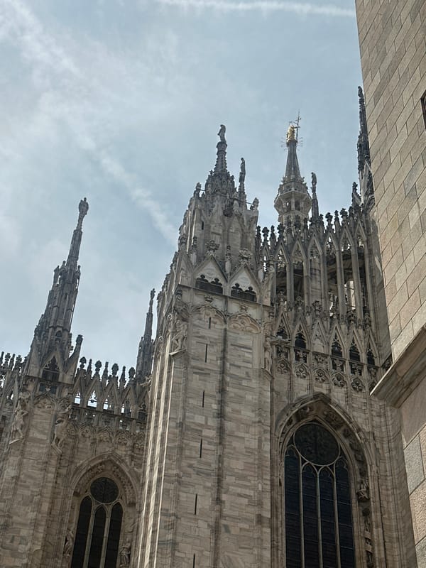 Morning walk through central Milan captures cathedral, shops, street life