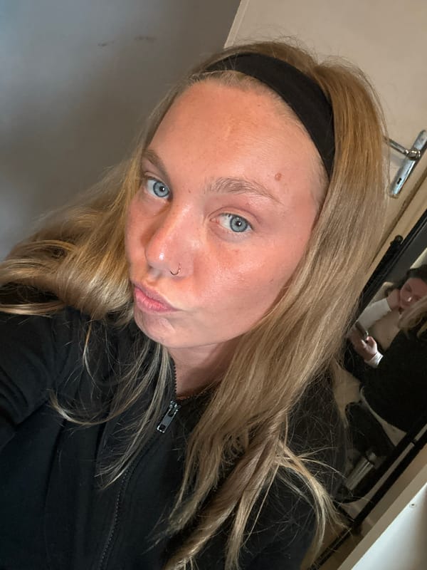 Woman takes selfies indoors in Lannoy, France