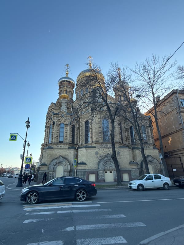 Sunny street scene with ornate church captured in Saint Petersburg