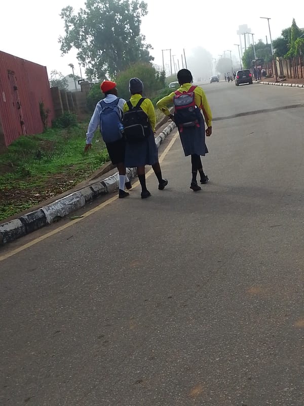 Morning pedestrian activity observed on Jos, Nigeria streets