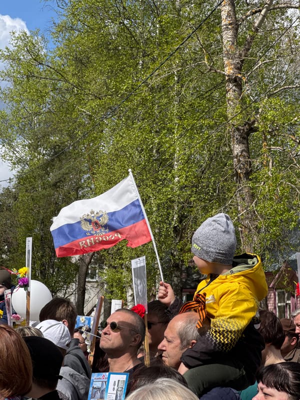 Crowd gathers with Russian flag in Chuprino public event