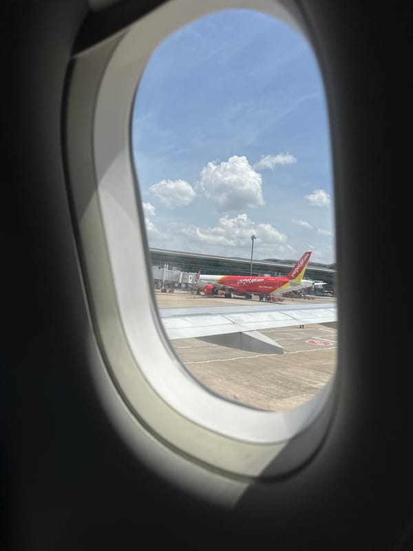 Moving through a Vietnamese airport on a Vietjet departure