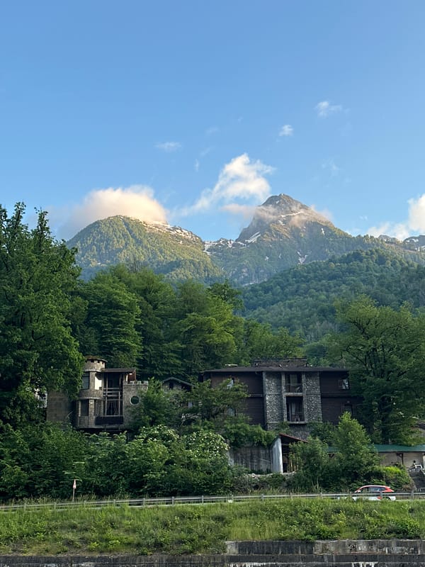 Strolling Rosa Khutor resort promenade in Russian Caucasus Mountains