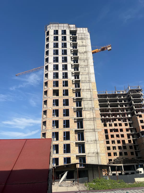 Construction underway in Lebedinovka, cranes and unfinished buildings