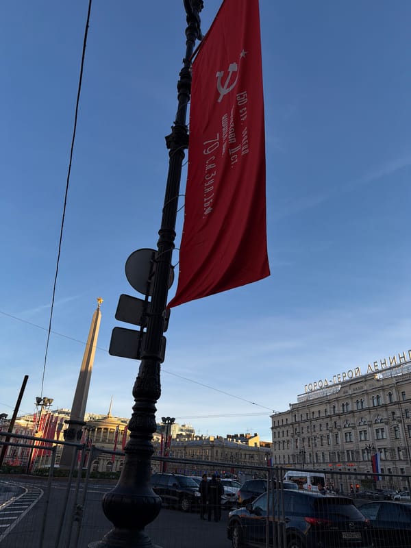 Soviet flag displayed on lamppost in Saint Petersburg