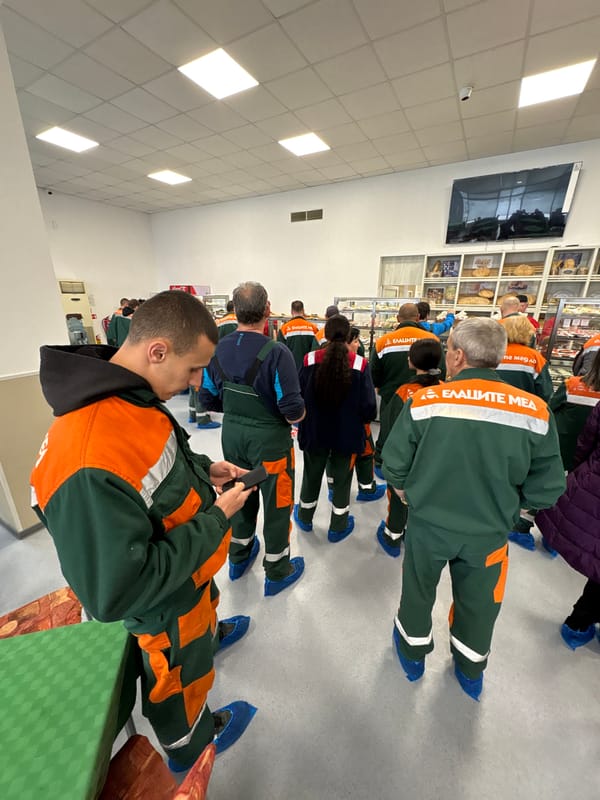 Workers in uniforms gather indoors in Mirkovo, Bulgaria
