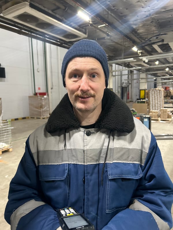Inside a Moscow warehouse, layered up in winter gear