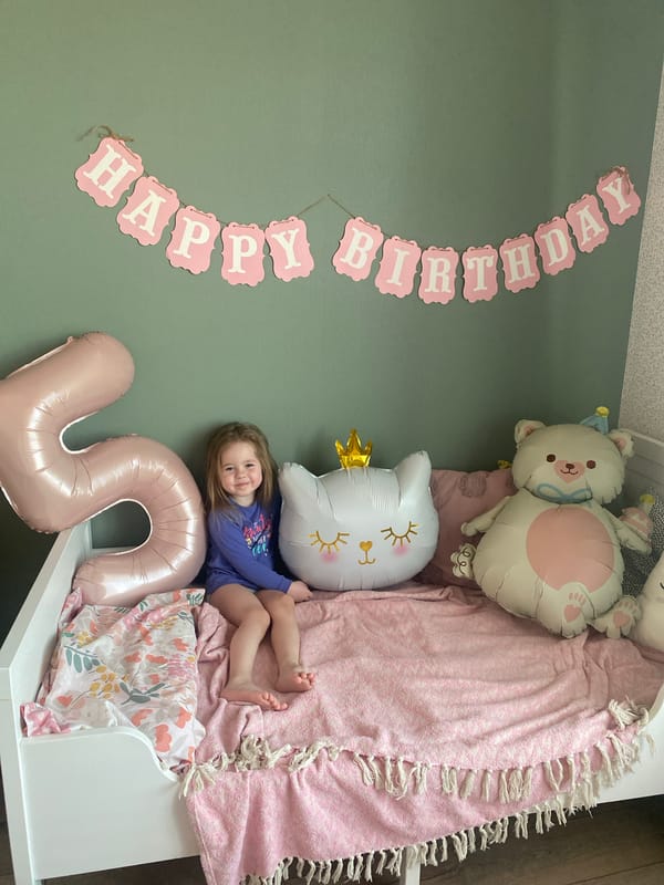 Child's fifth birthday celebration captured in Izhevsk bedroom