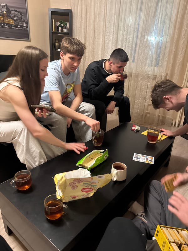 Young adults gather for games and tea in Kazan apartment