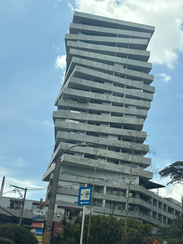 Modern stacked building with unique architecture documented in Medellín