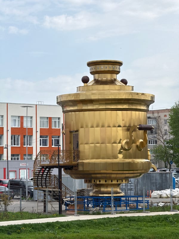 Tourist visits golden samovar monument in Bor, Russia