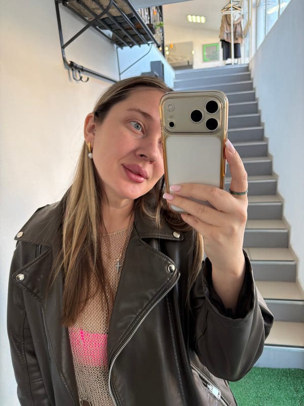 Woman takes mirror selfies indoors in Chaikovsky, Russia