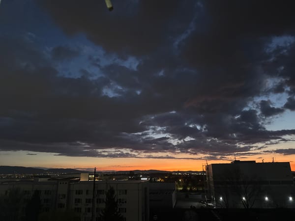 Dramatic storm clouds gather over Sofia at dusk