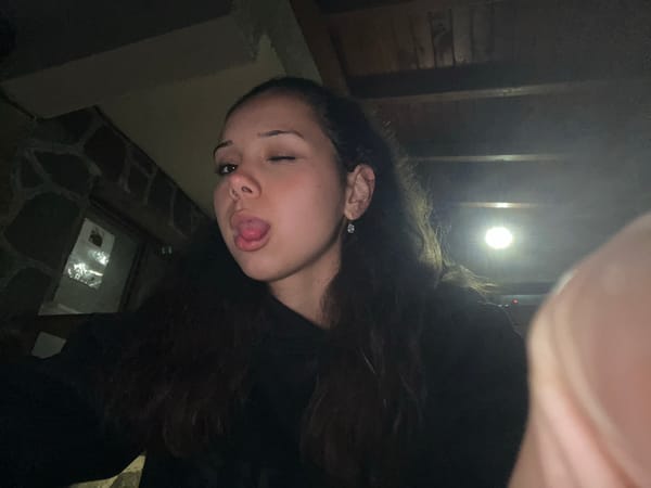 Woman takes playful selfies with dog in Bulgarian home