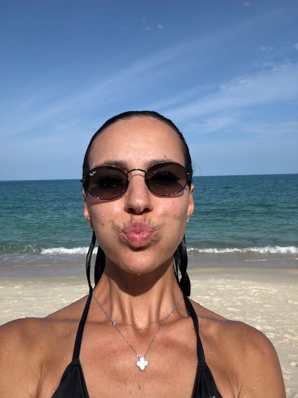 Beachside selfie with ocean backdrop on a sunny day