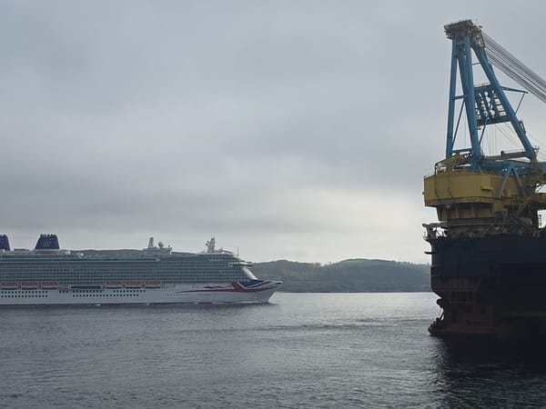 Cruise ship BRITANNIA sails past Randaberg Norway in misty dawn