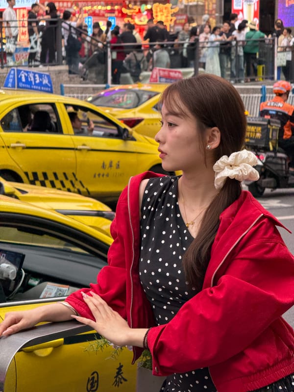 Young women spotted near yellow taxis in Liangjiang