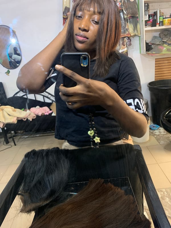Woman documents hair salon visit with selfies in Jos